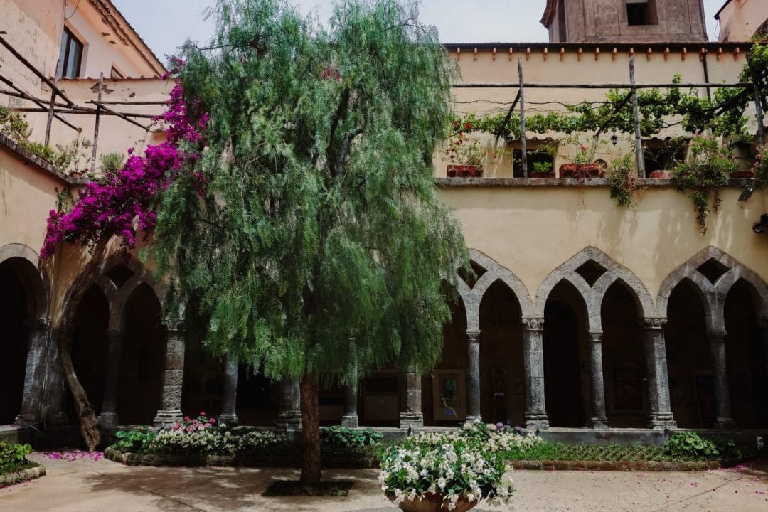 italy Amalfi coast sorrento monastery architecture tree plants arches patio fountain 