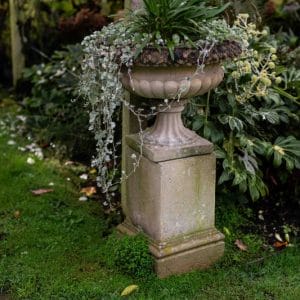Pair of Composite Stone Garden Urns on Square Pedestals